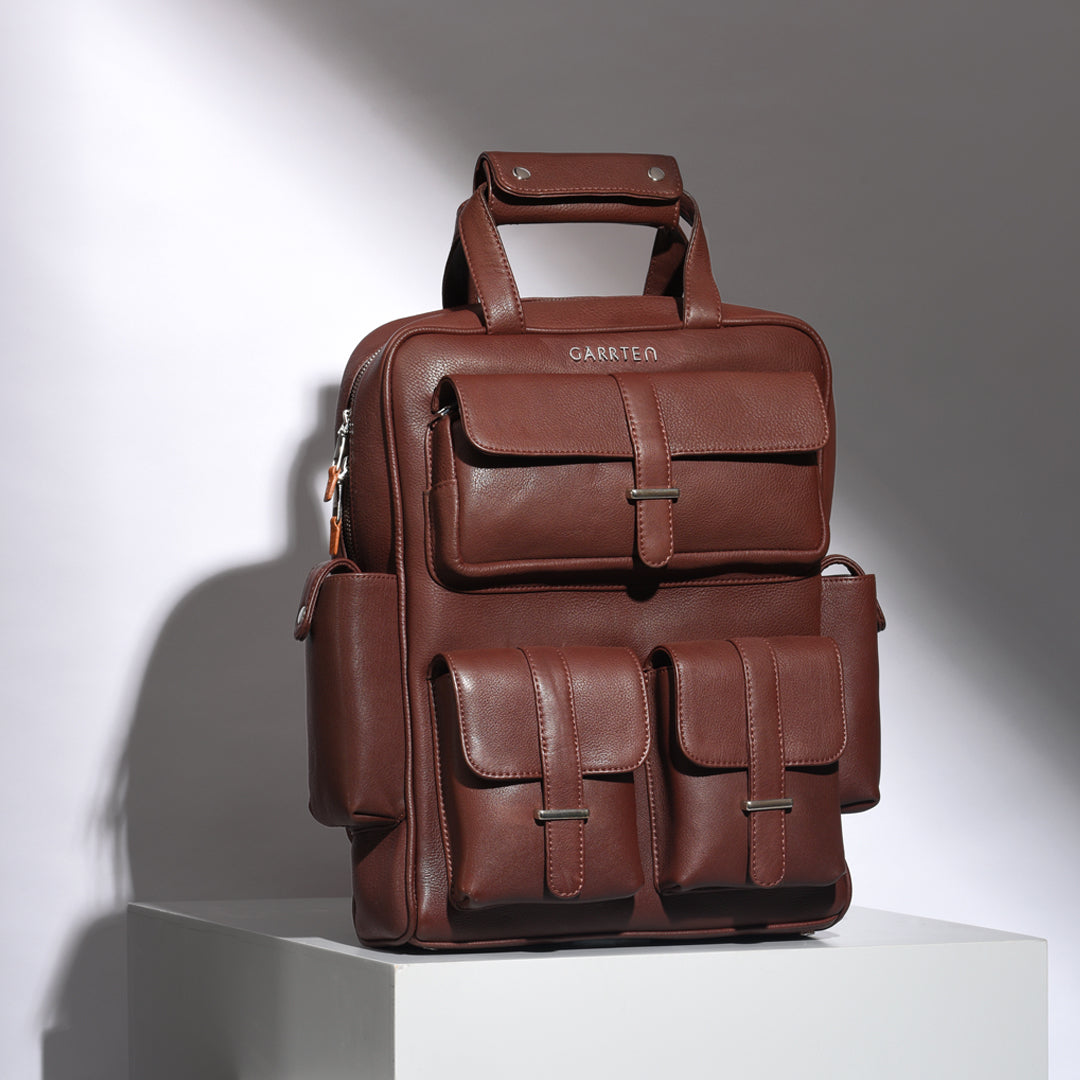 Mahogany Brown: tilted front view of Garrten travel full grain leather backpack